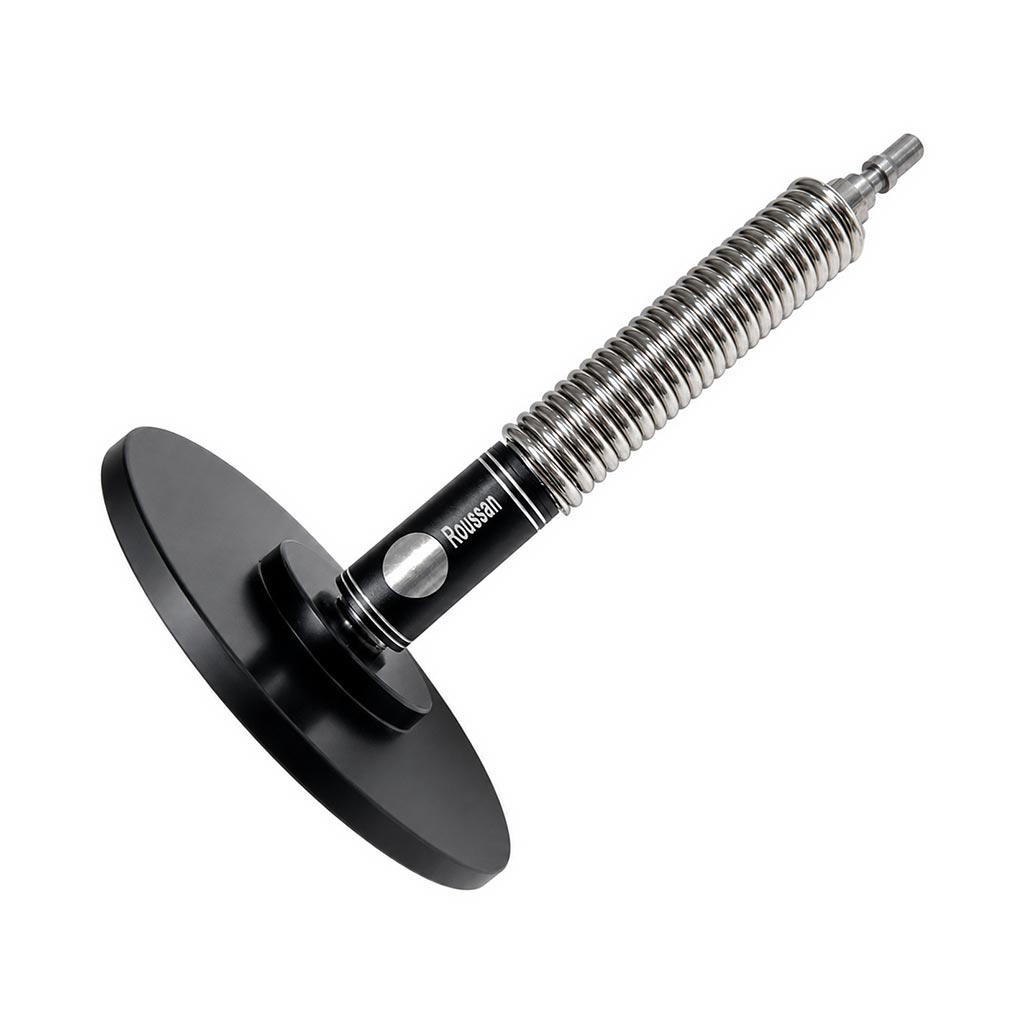 Flexible spring extension connects to a suction cup dildo adapter.