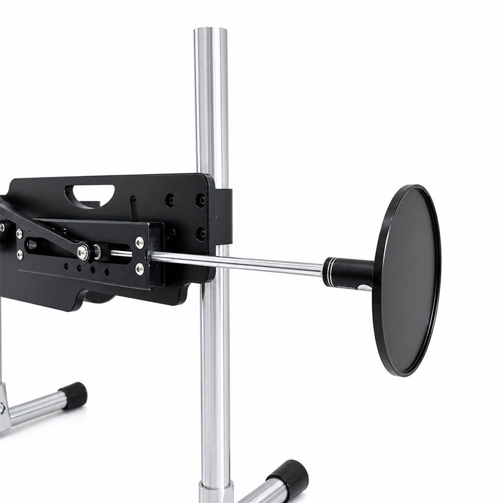 Metal suction cup adapter attached to Roussan Elves sex machine for use with suction-base dildos.